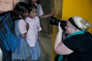 Katie Rickman shooting a photo at a school in Delhi